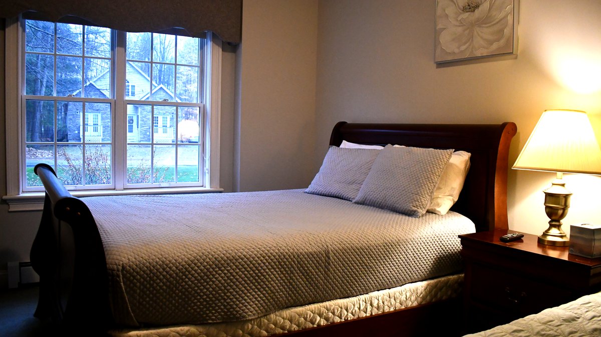 A freshly made bedroom after an ABF Cleaning visit